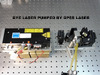 090 Liquide laser pumped by DPSS doubled laser